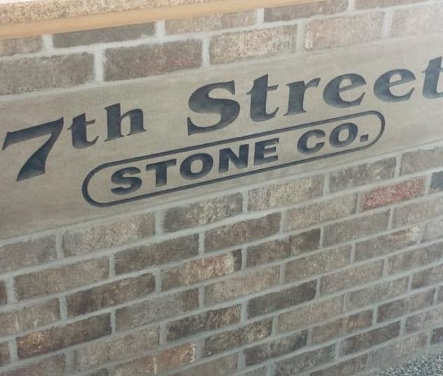 The 7th Street Stone Co. name engraved into a limestone sign